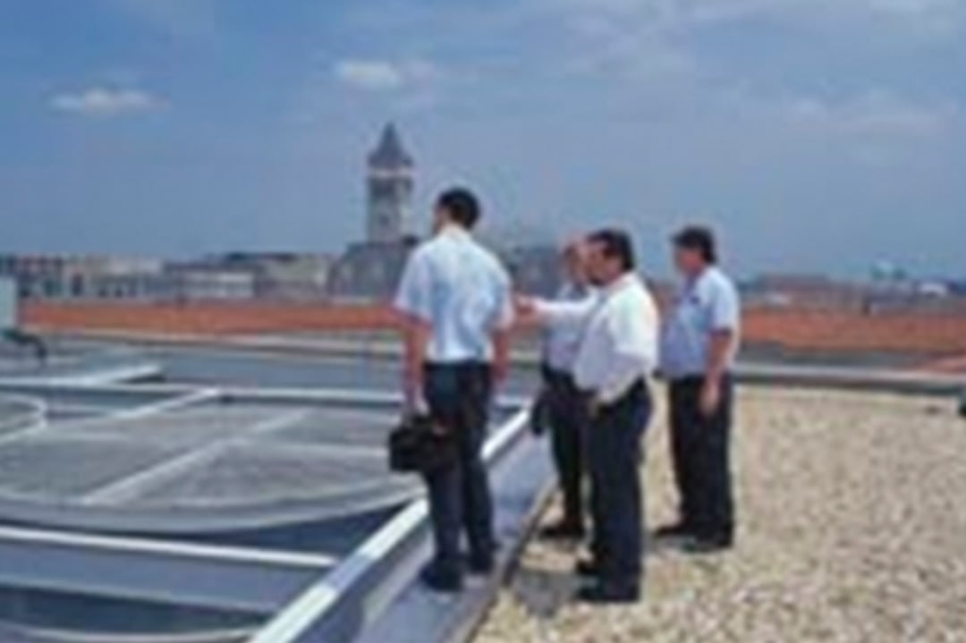 Engineers on a building rooftop